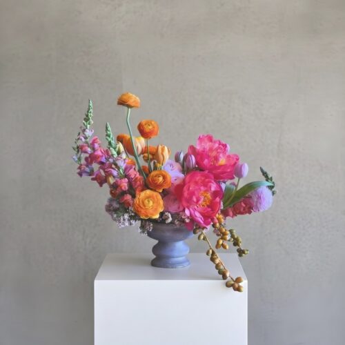 Once-and-Florall-Designs-Valencia-Sorbet-bright-orange-citrus-floral-arrangement-white-column-St-Augustine-florist